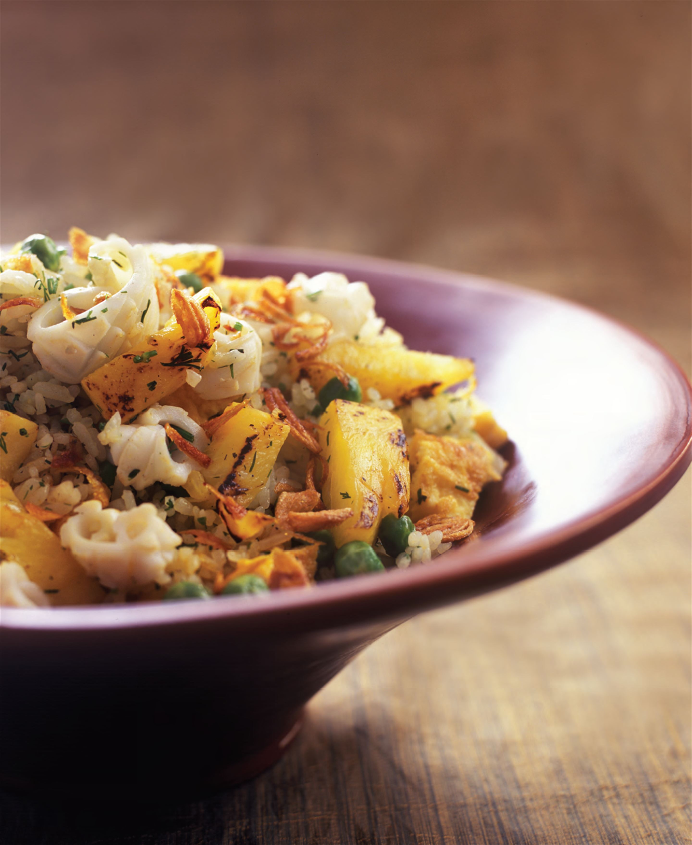 Fried rice with cuttlefish, pineapple and dill