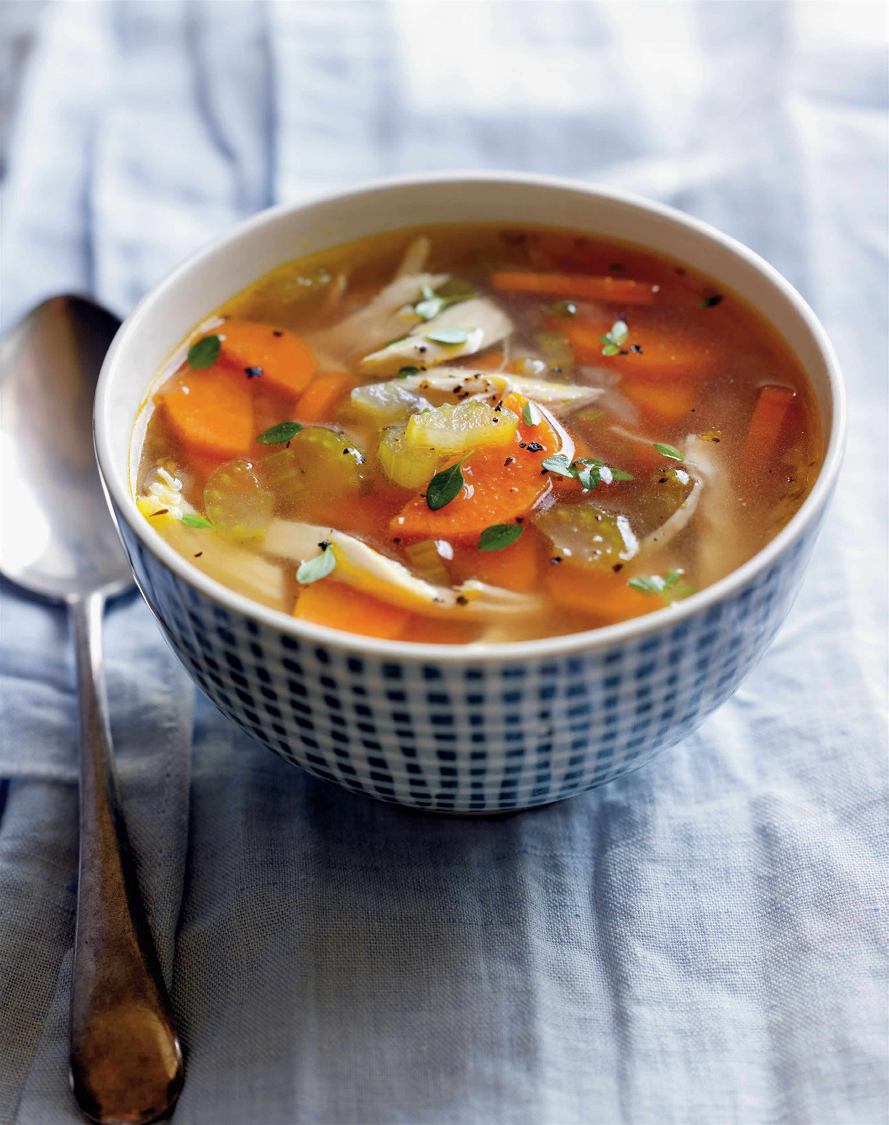 Chicken soup with carrot, lemon and thyme