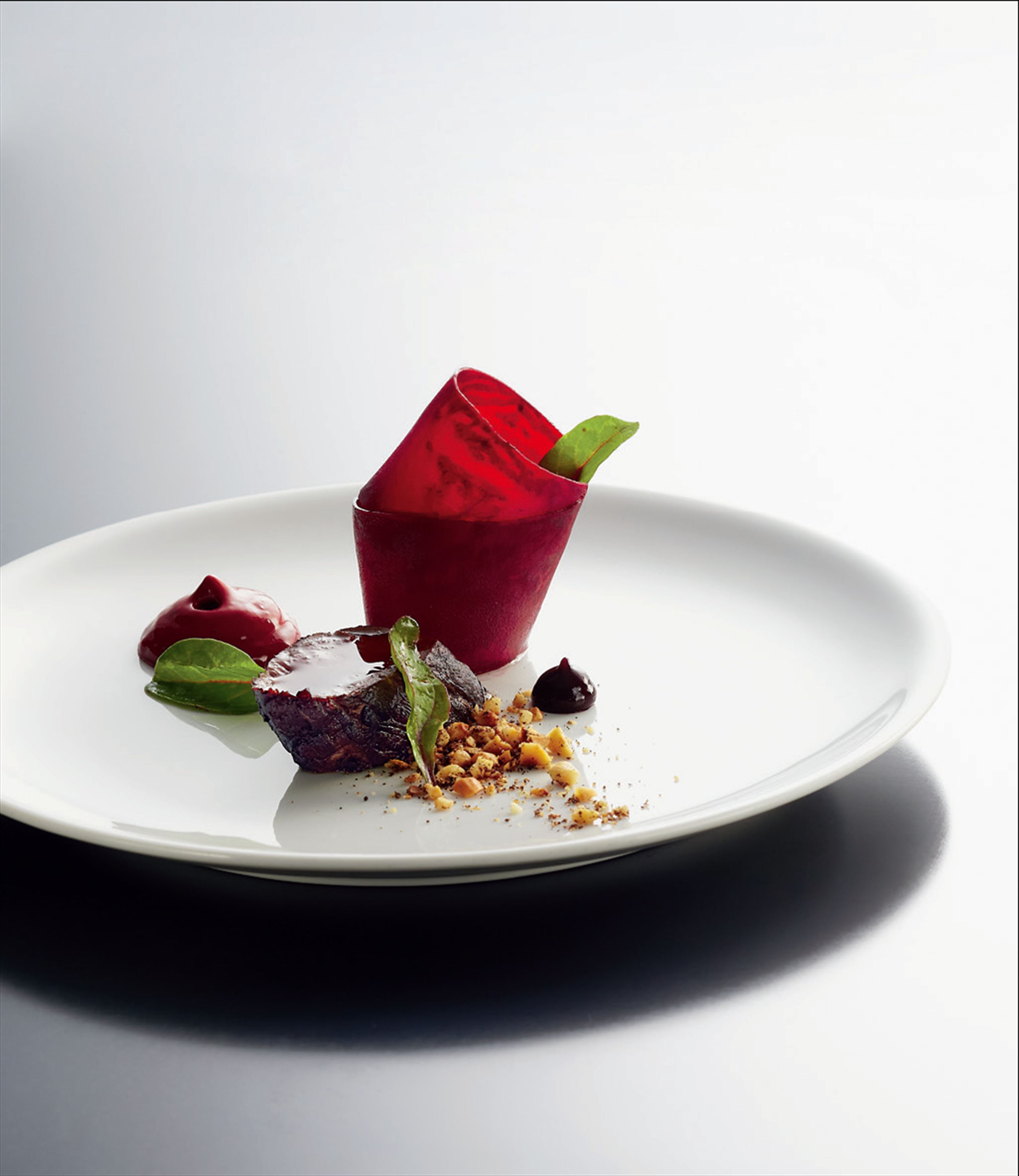 Venison tenderloin with beetroot and cocoa, and peanut and vanilla crumble