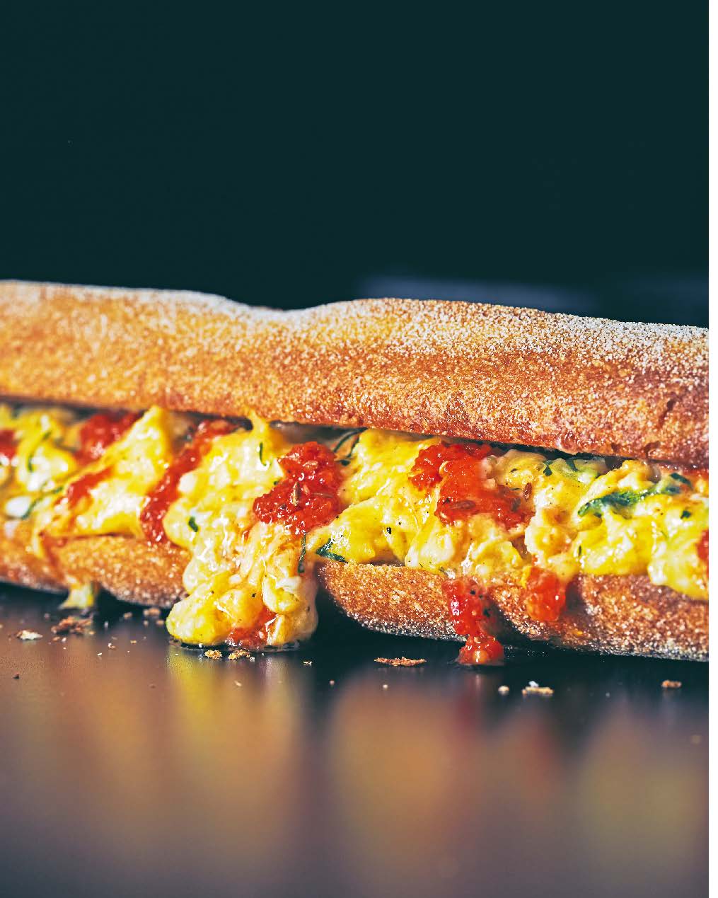 Toasted baguette with scrambled egg + harissa