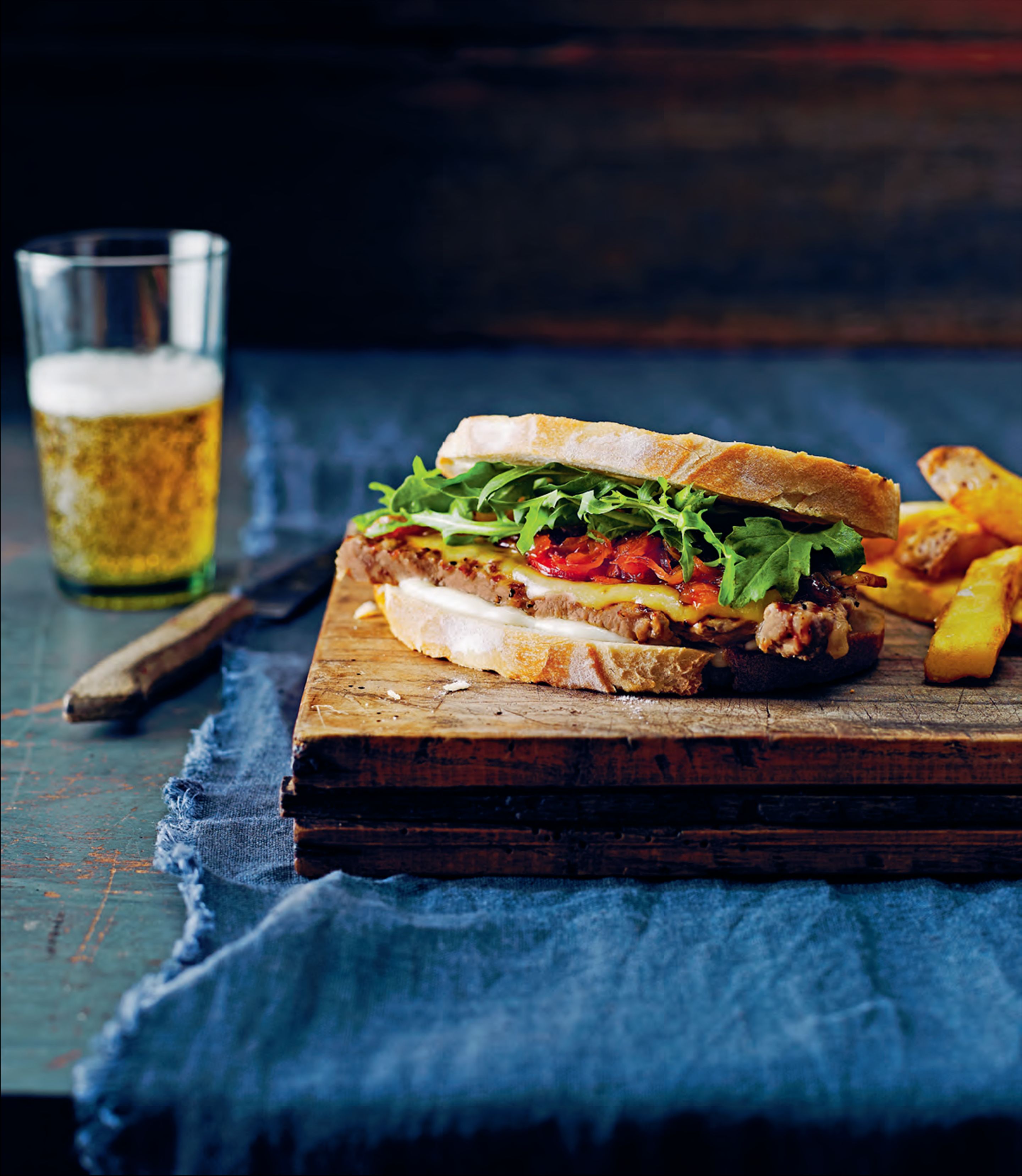 Steak sandwiches with caramelised onion, smoked cheddar and bacon