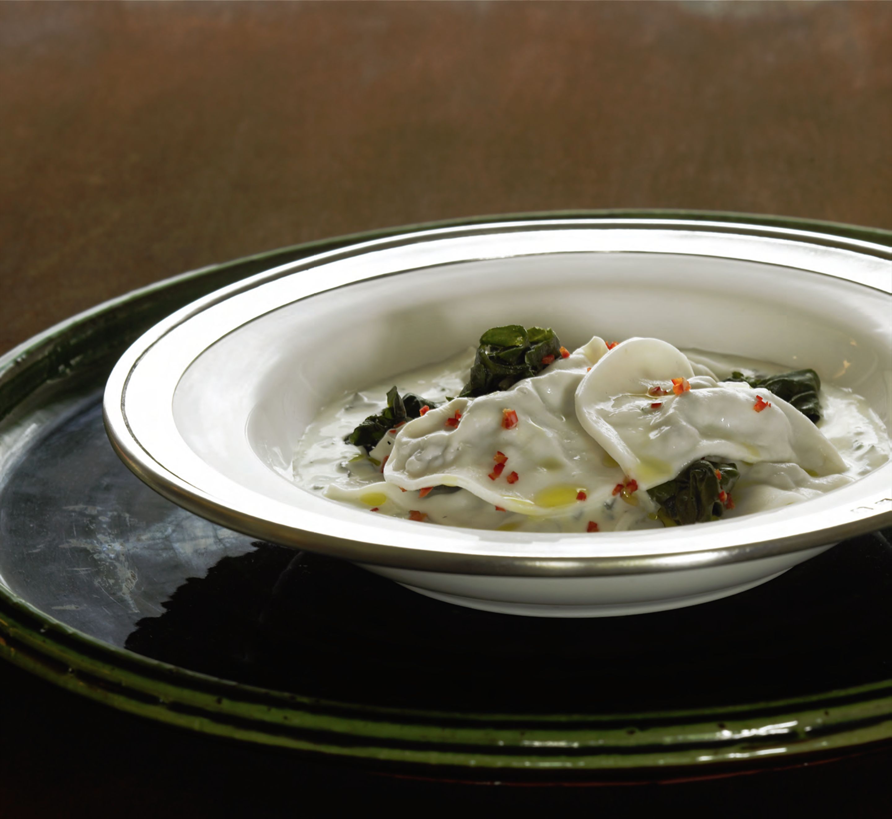 Chiche barak Lebanese-style dumplings in yoghurt soup with silverbeet