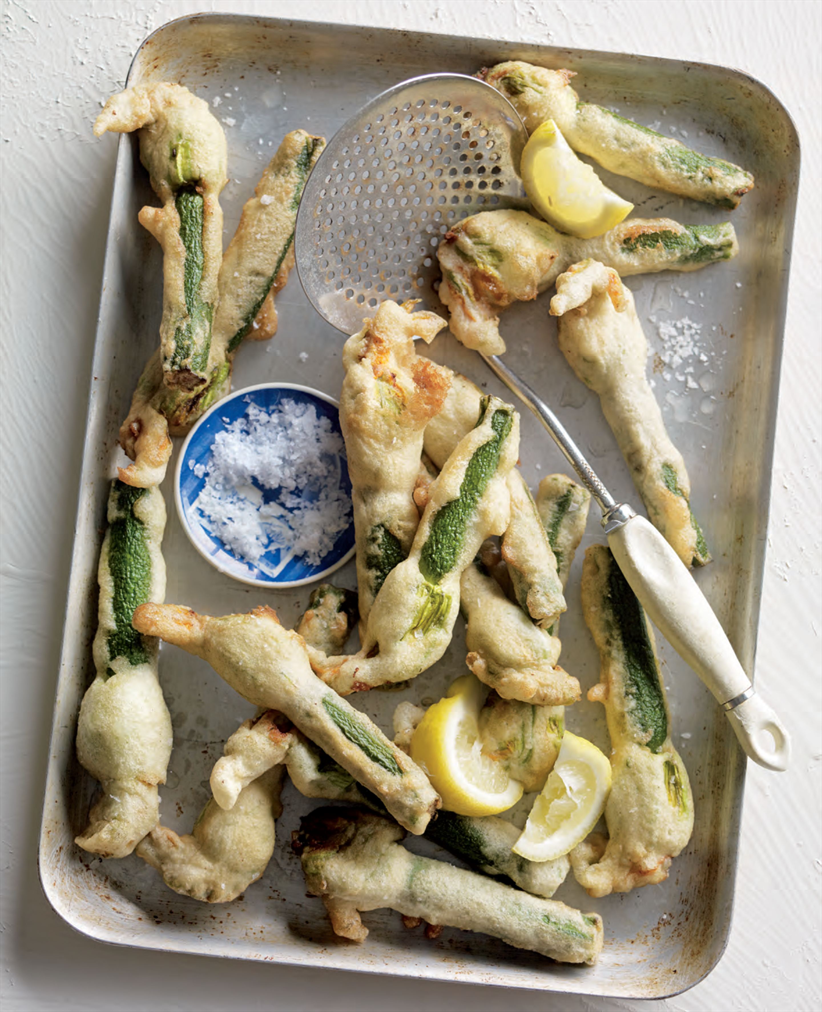 Ouzo-battered zucchini flowers stuffed with goat’s curd