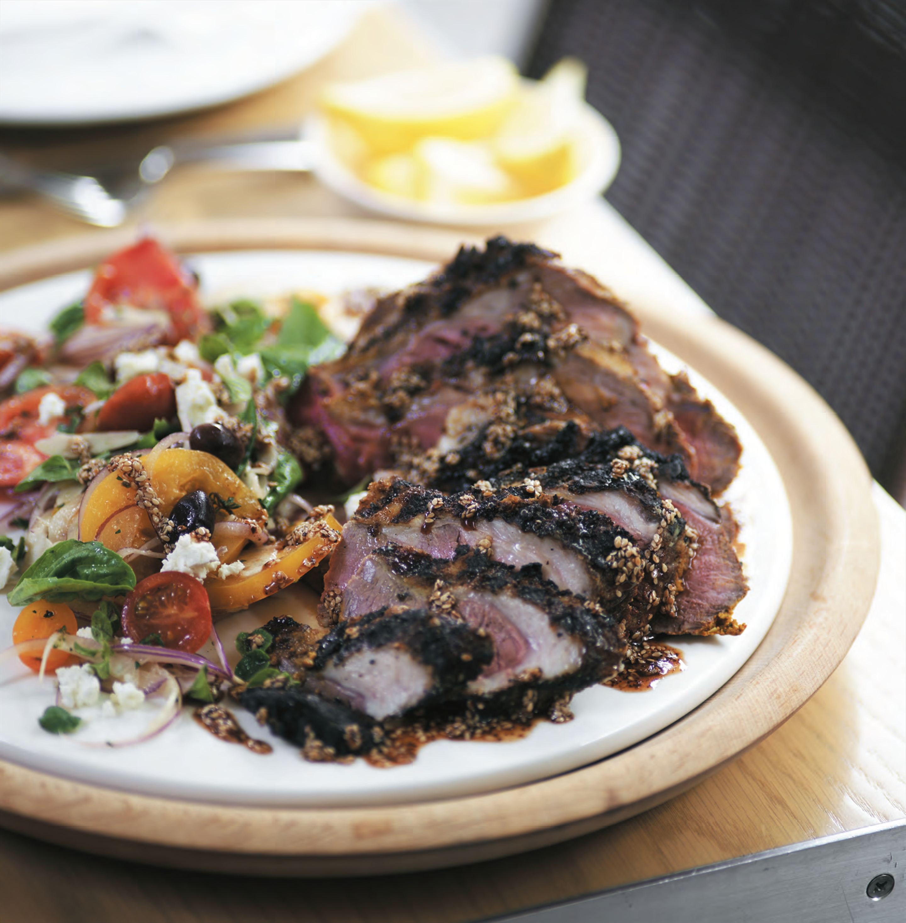 Barbecued butterflied leg of lamb with Lebanese tomato salad
