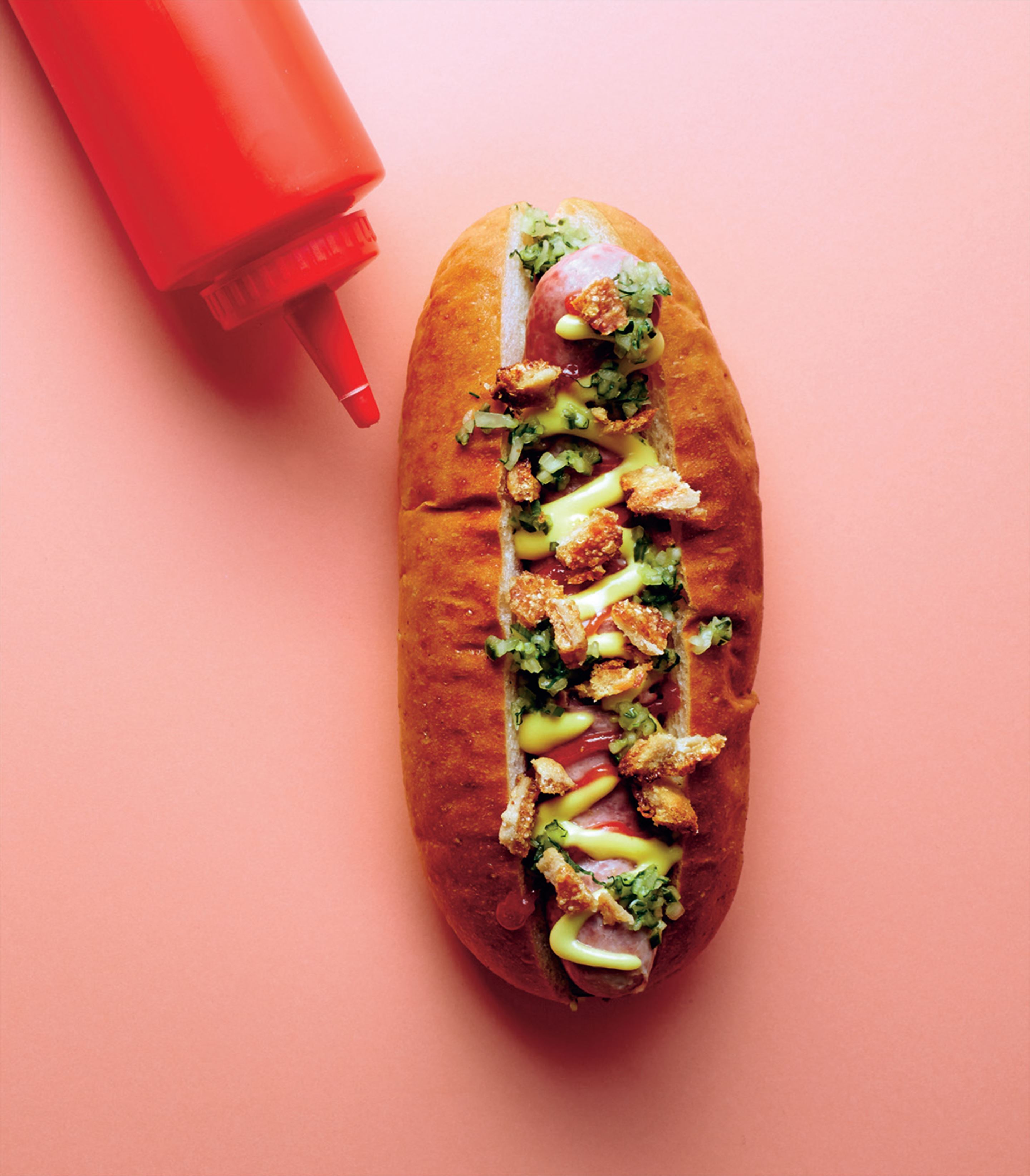 Maple-glazed bacon dog with tomato & quince relish and mustard pickles