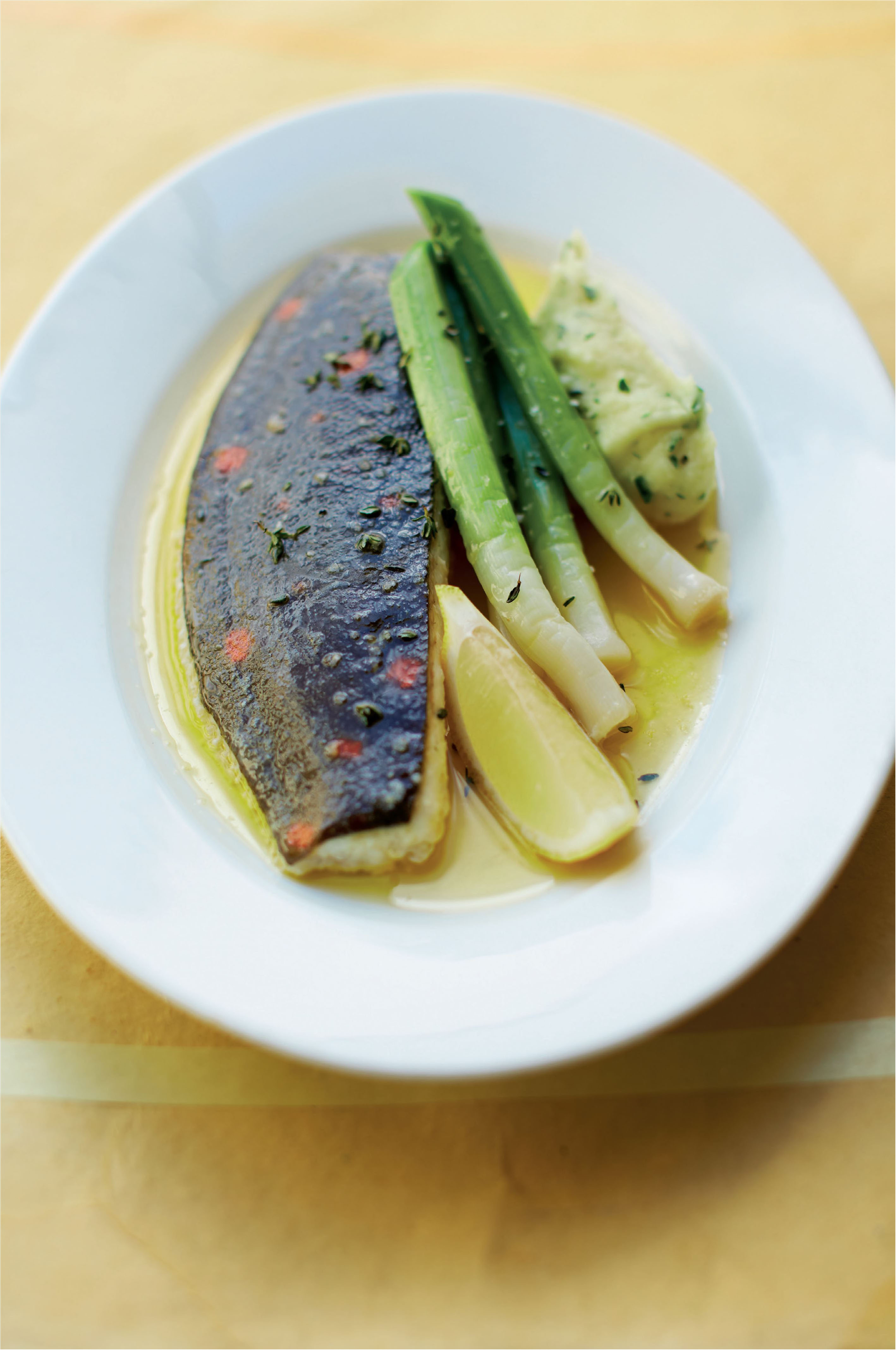 Plaice poached in butter with leeks, and parsley and mustard mash
