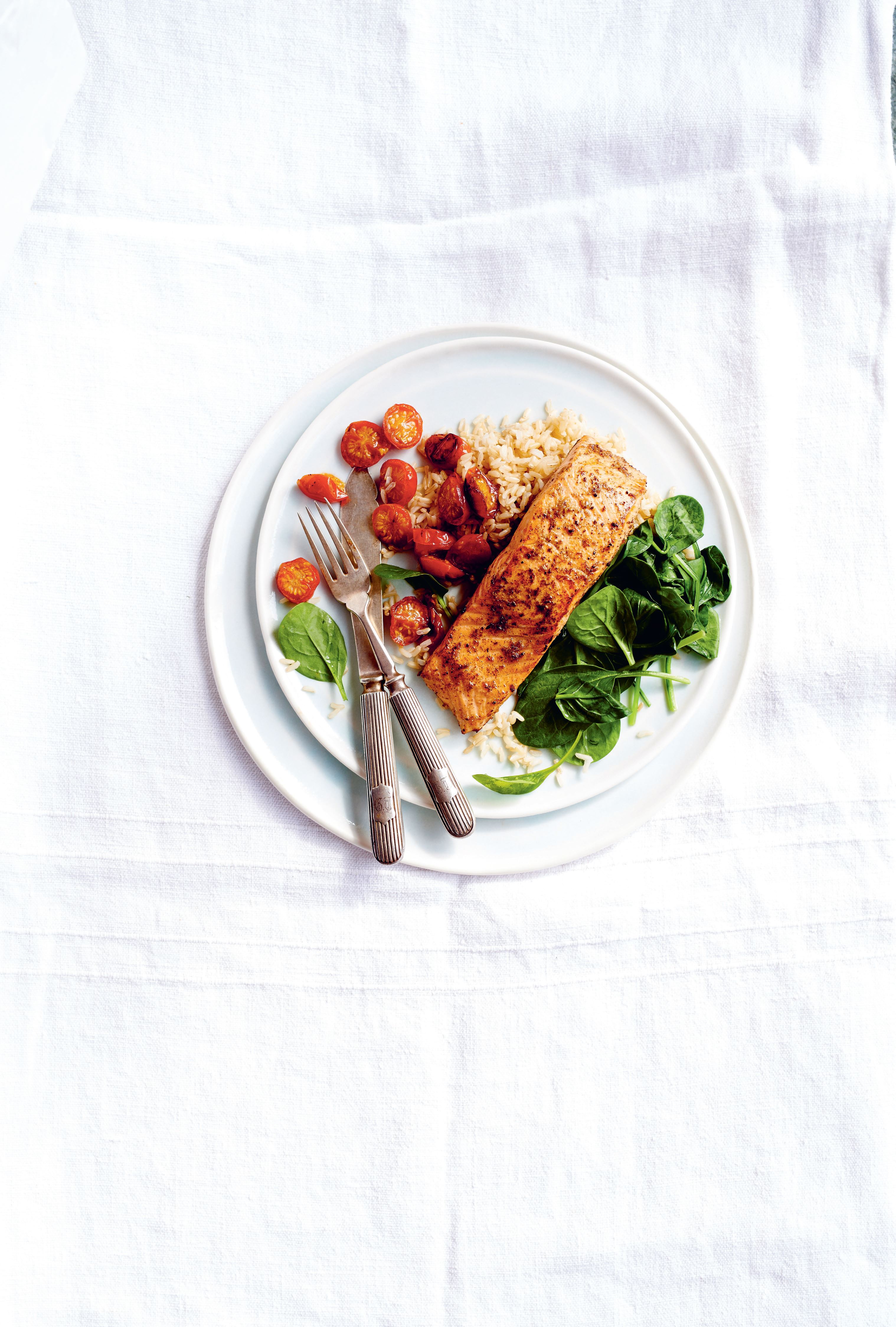 Pan-fried marinated salmon with wilted baby spinach