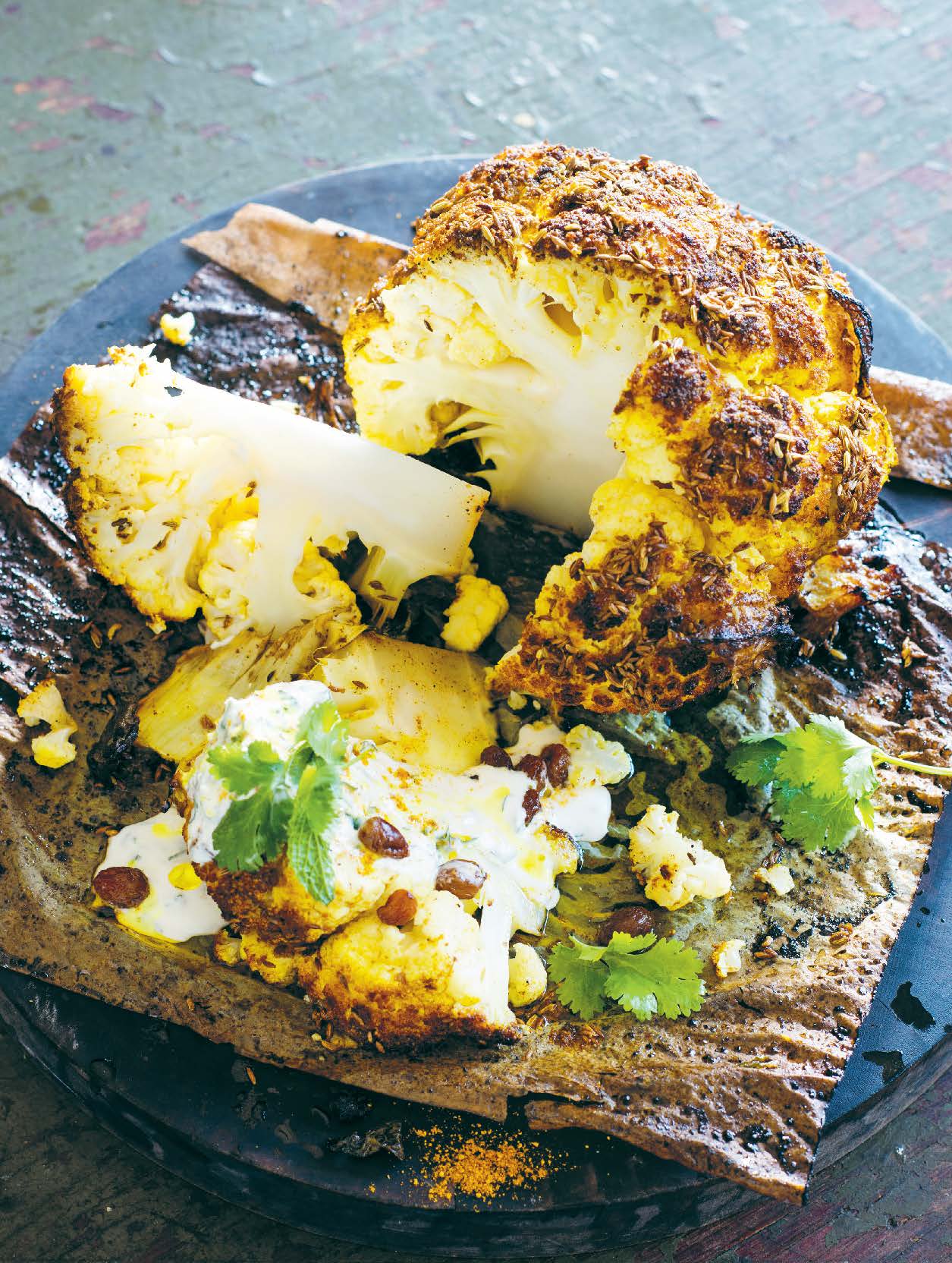 Baked whole cauliflower with Indian spices, mint and yoghurt
