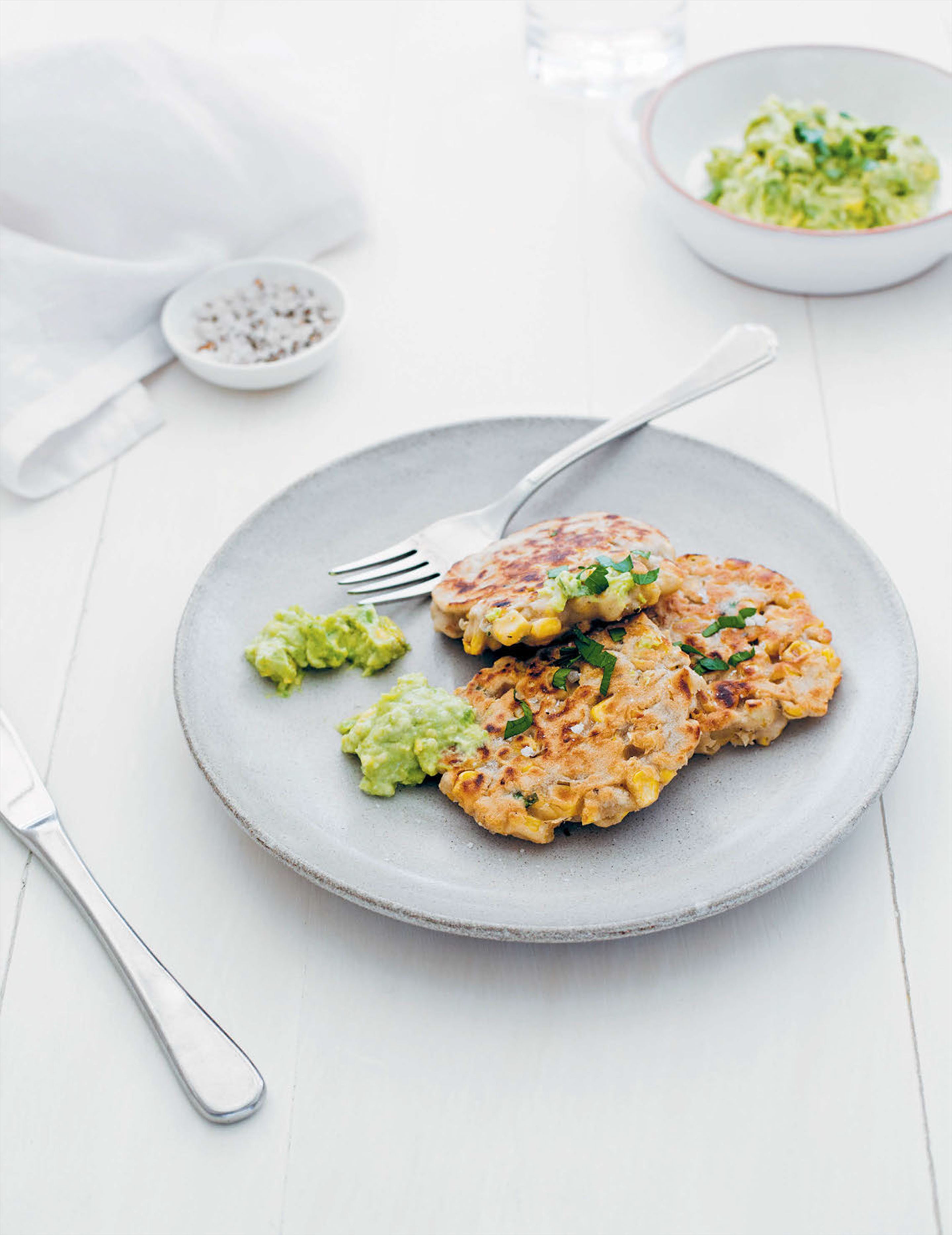 Corn fritters with avocado and ‘goat’s’ cheeses mash