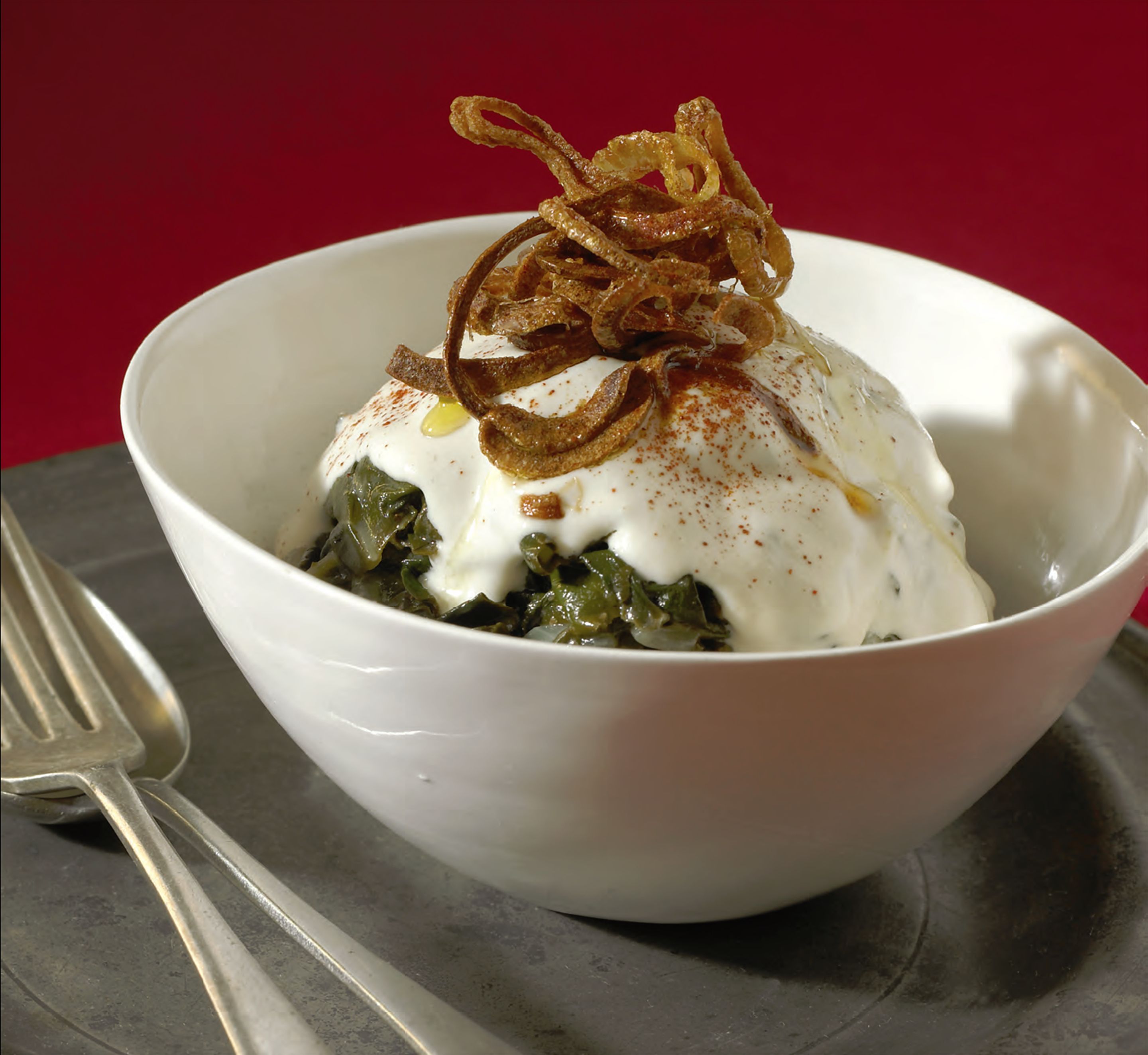 Braised silverbeet with crisp fried onions and tahini sauce