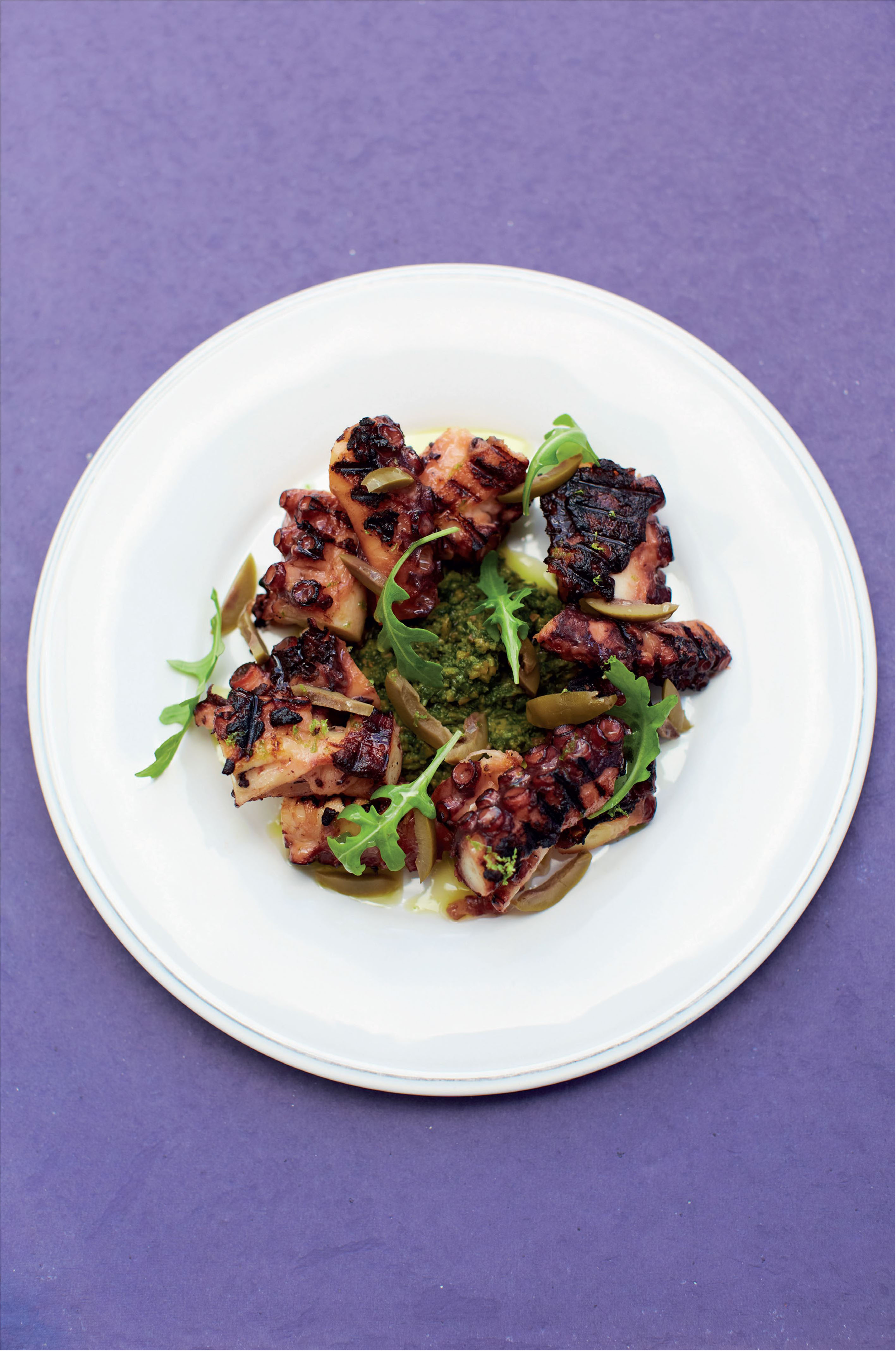 Braised octopus with lime, olive and rocket dressing