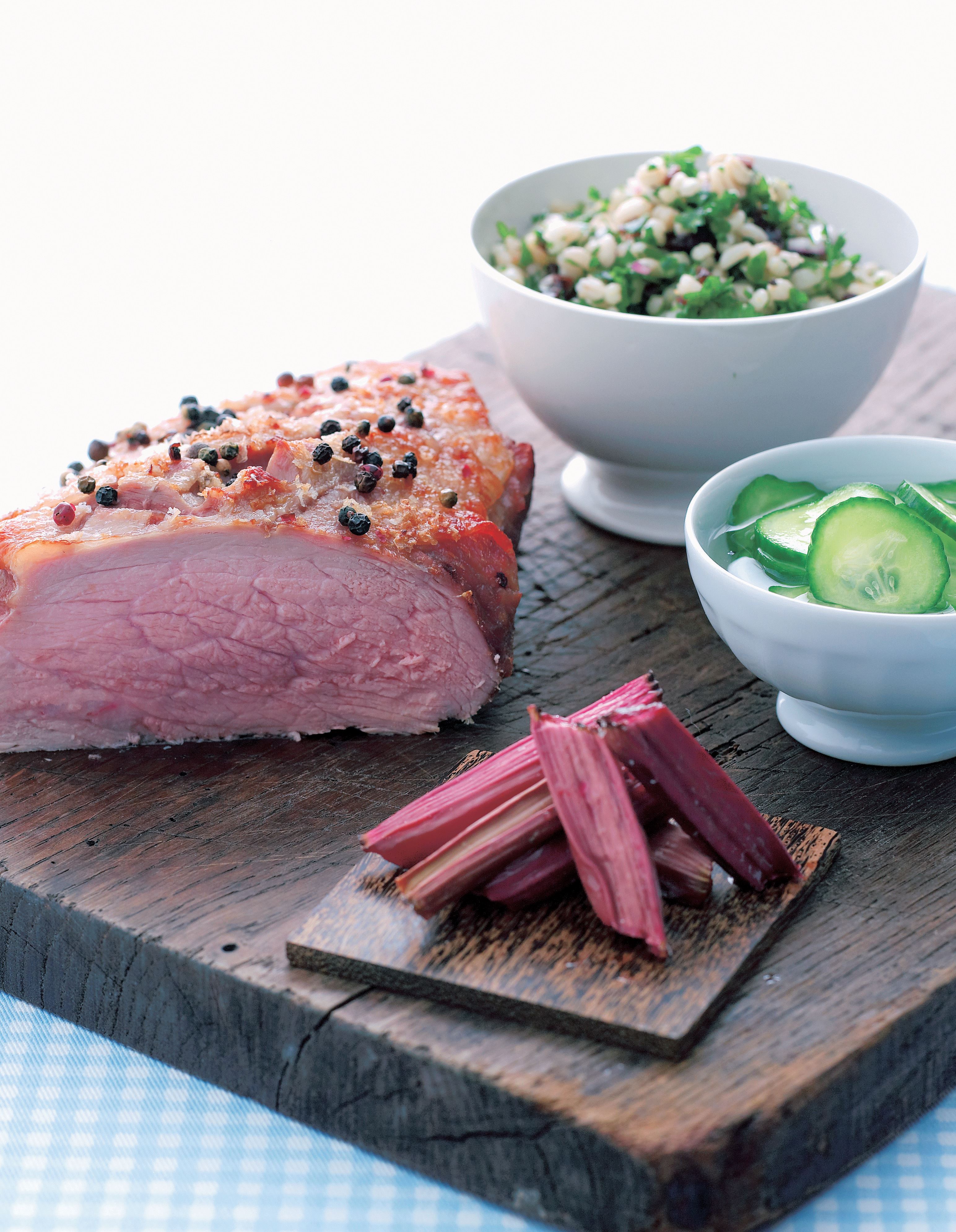 Veal with baked rhubarb, sweet and sour cucumber salad, and barley salad