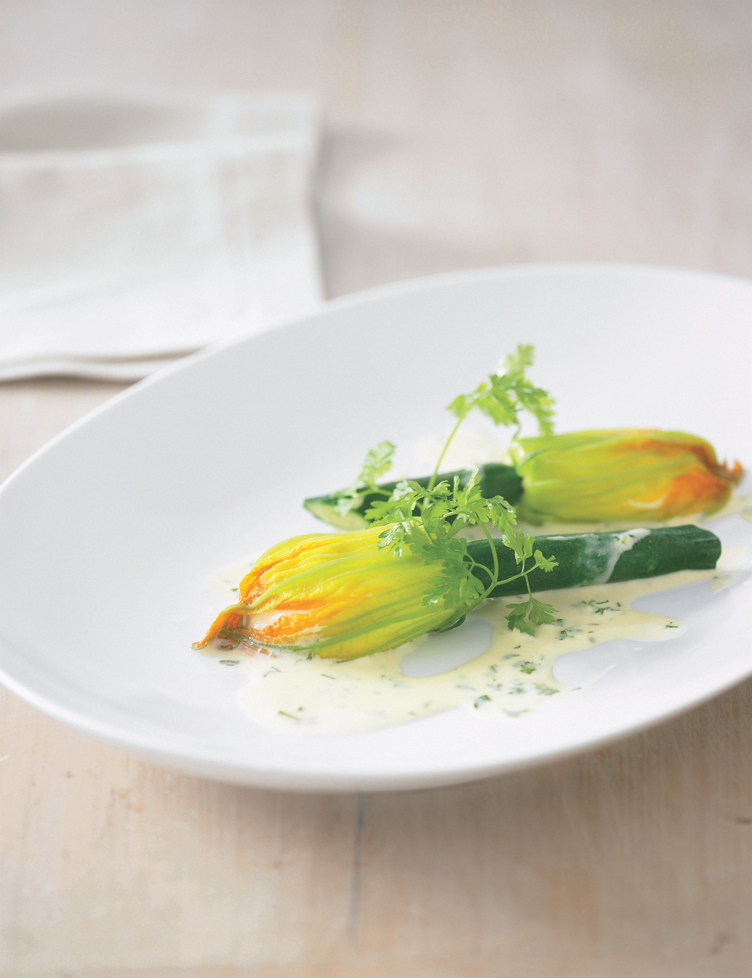 Steamed zucchini flowers and scallop mousse with Noilly Prat and chervil velouté