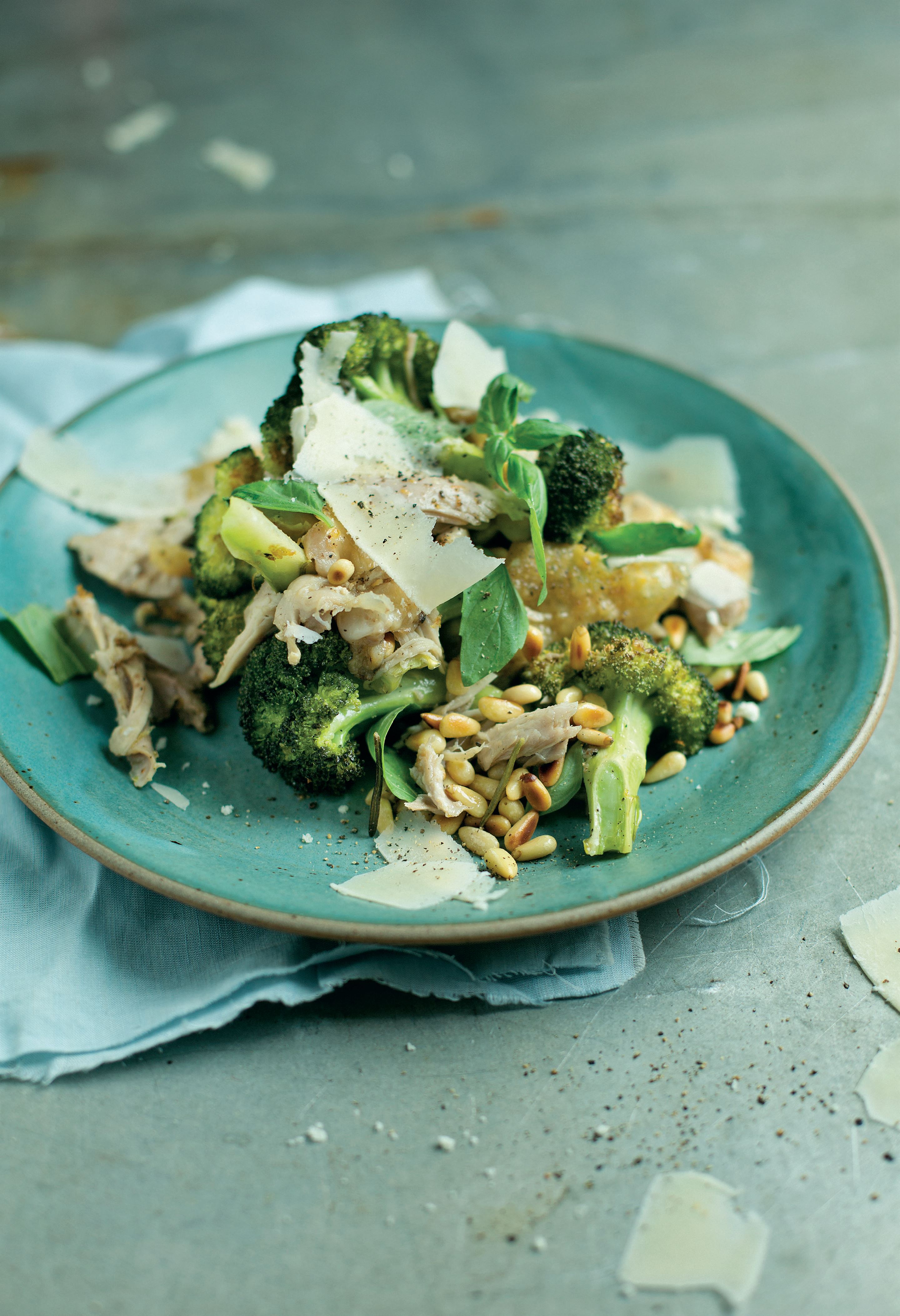 Roast broccoli with shredded chicken, pine nuts and basil