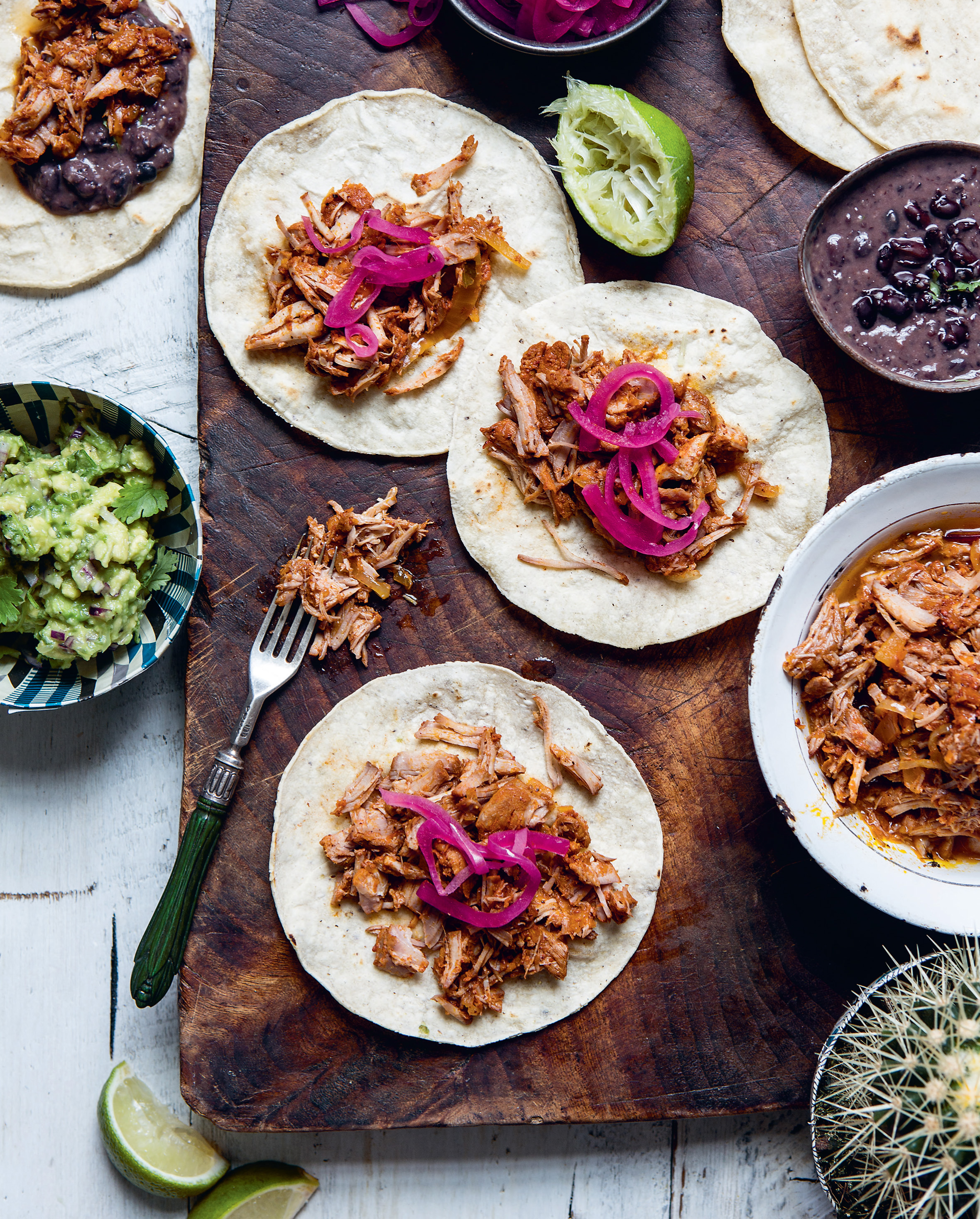 Melting Mexican pork tacos with pink pickled onions