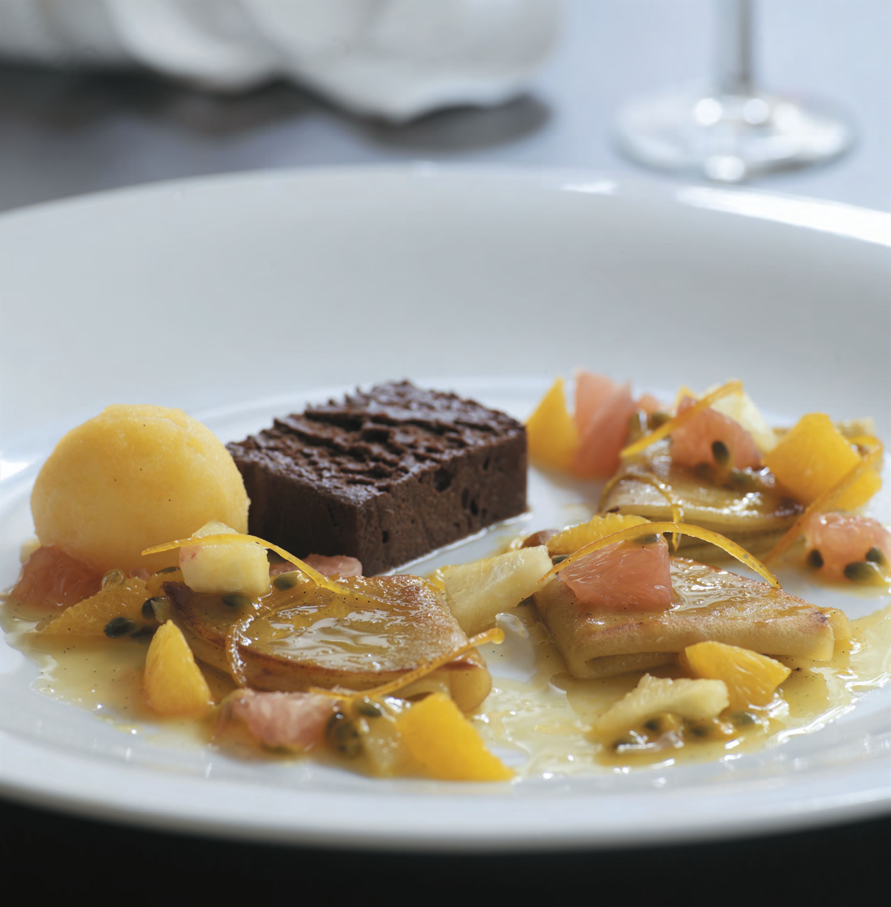 Chocolate terrine with warm passionfruit crêpes suzette and citrus salad