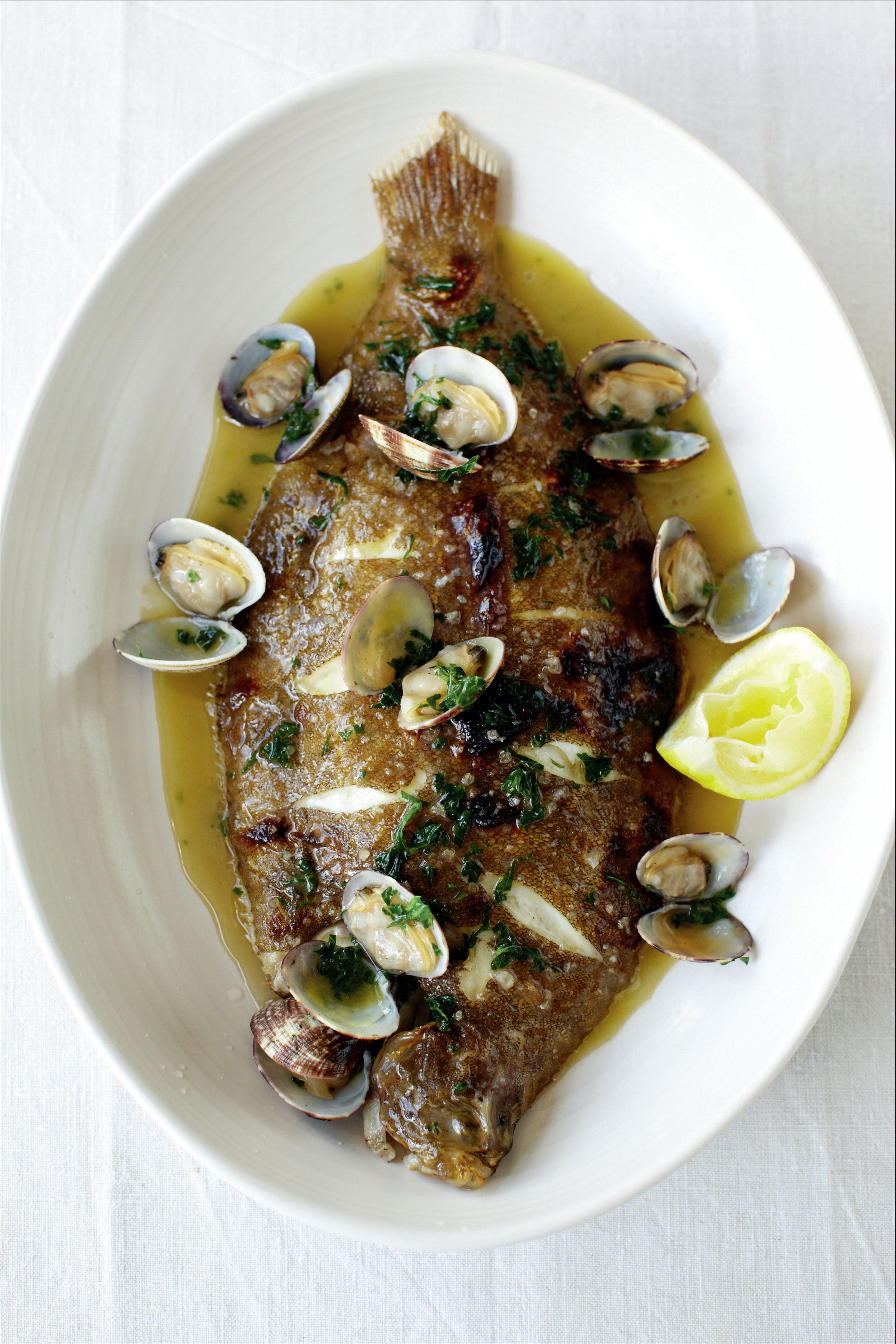 Lemon sole on the bone with parsley and clam butter