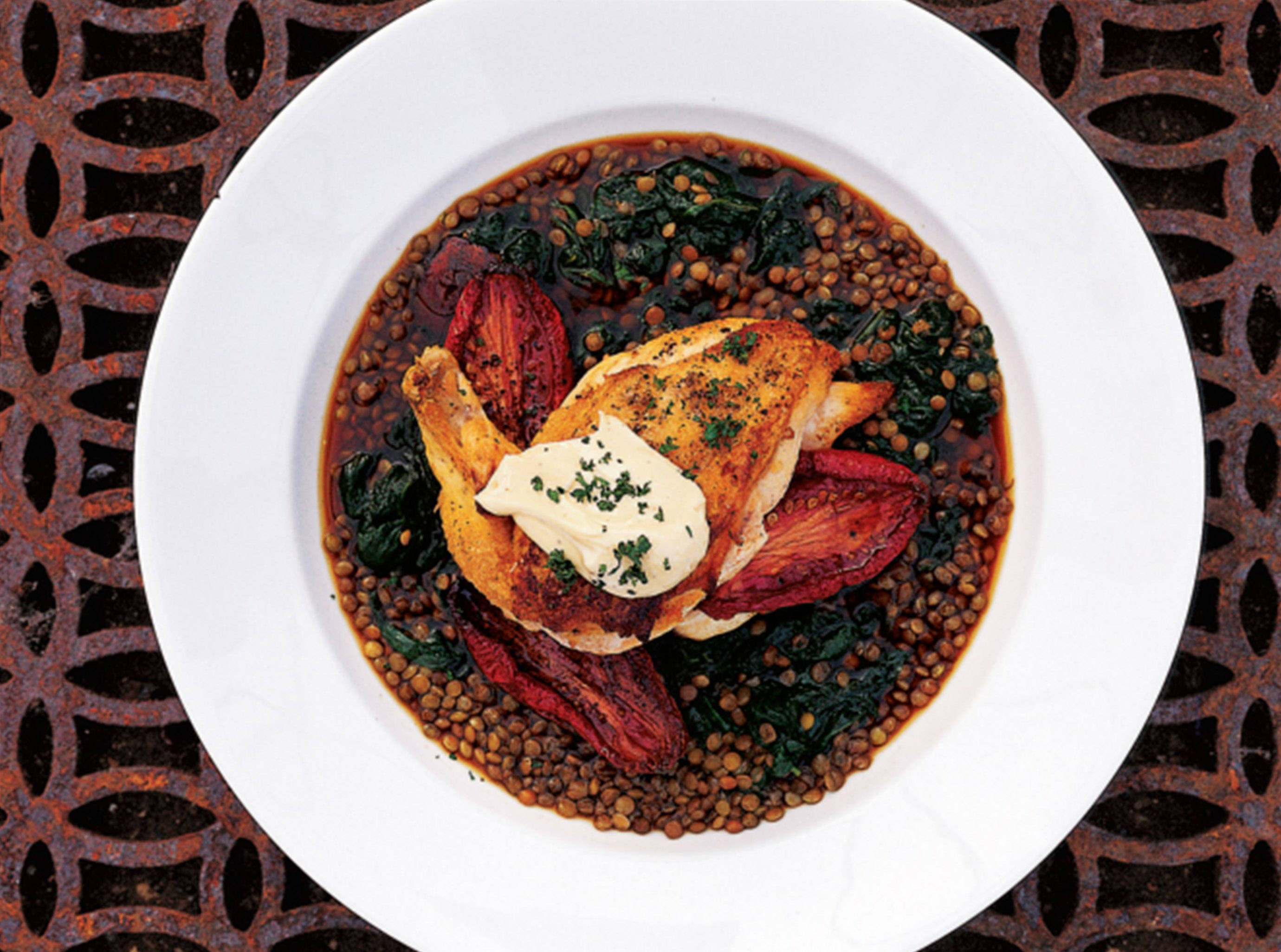 Pan-roasted chicken with lentils, roasted tomatoes and basil oil