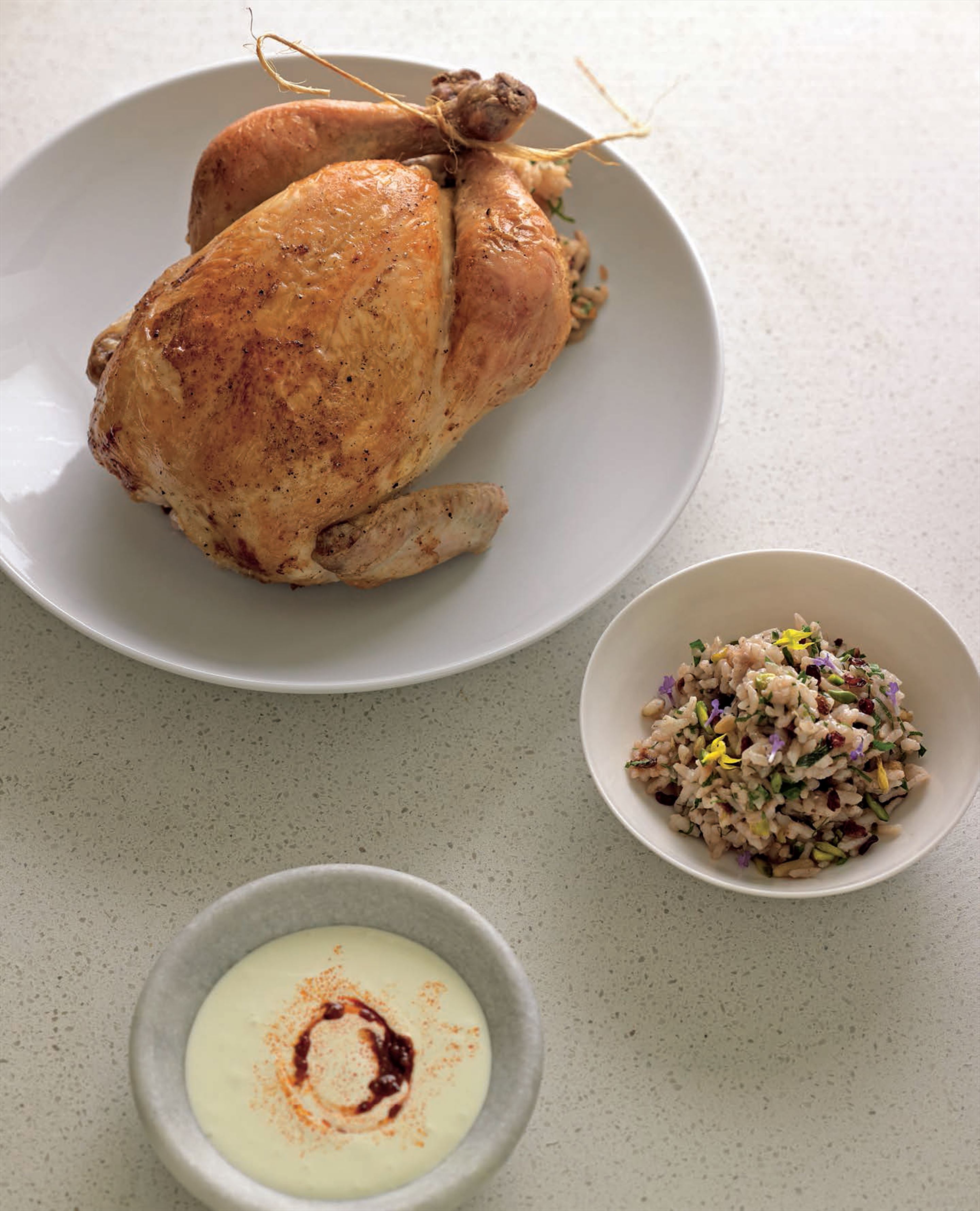 Roast chicken with pine nut and barberry rice stuffing