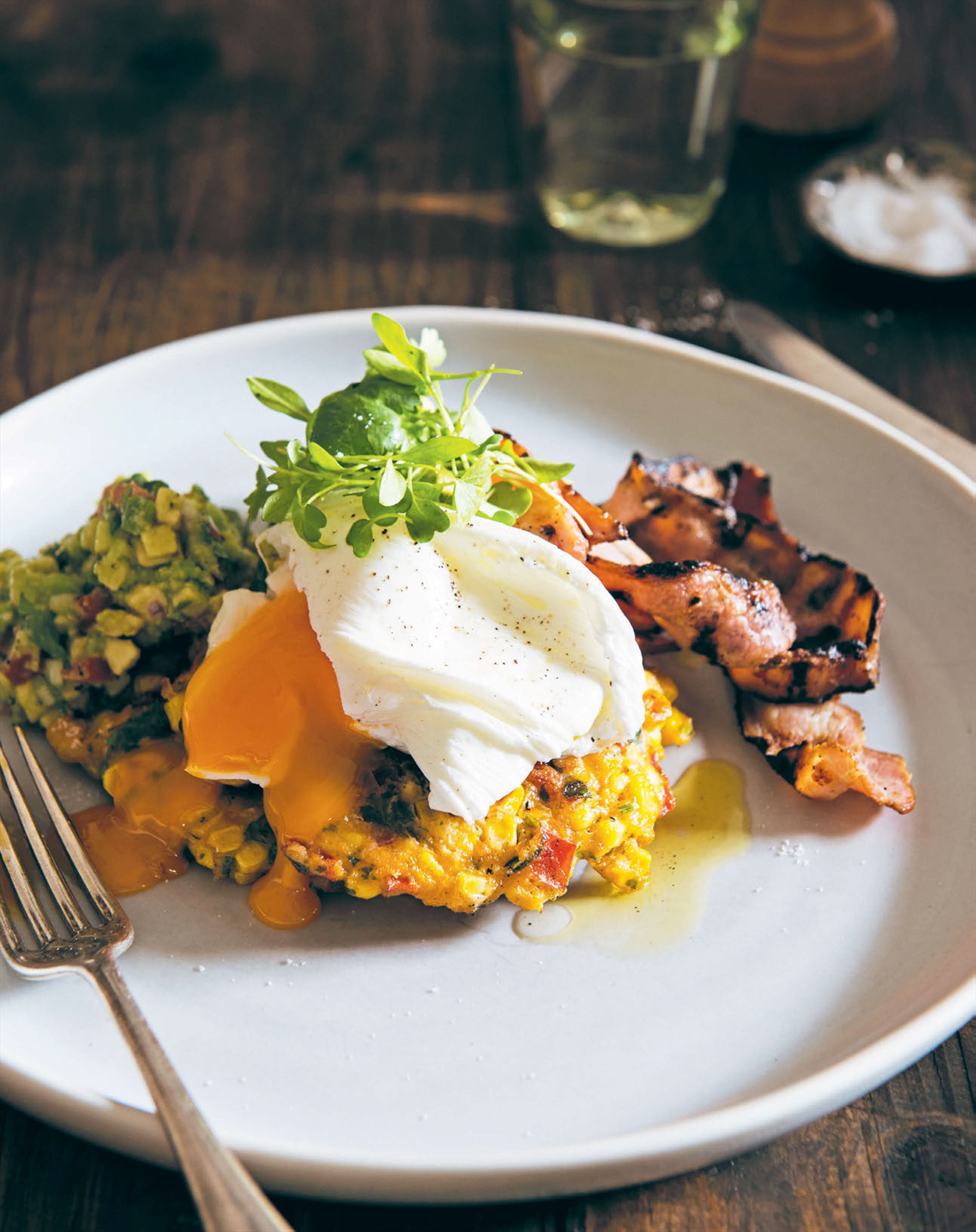 Corn cakes with grilled bacon, avocado salsa & poached eggs