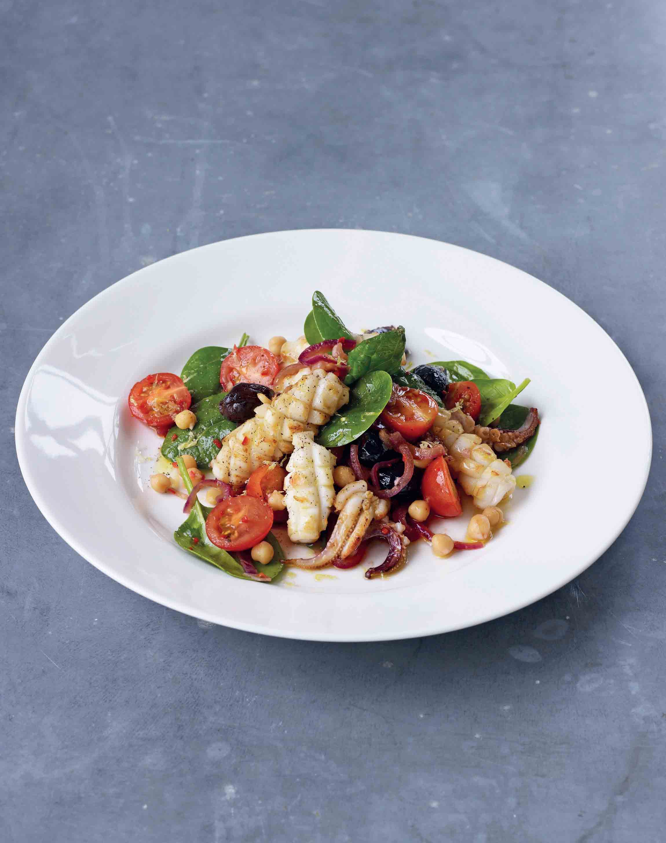 Pan-fried squid with chickpea, tomato, olive and chilli salad