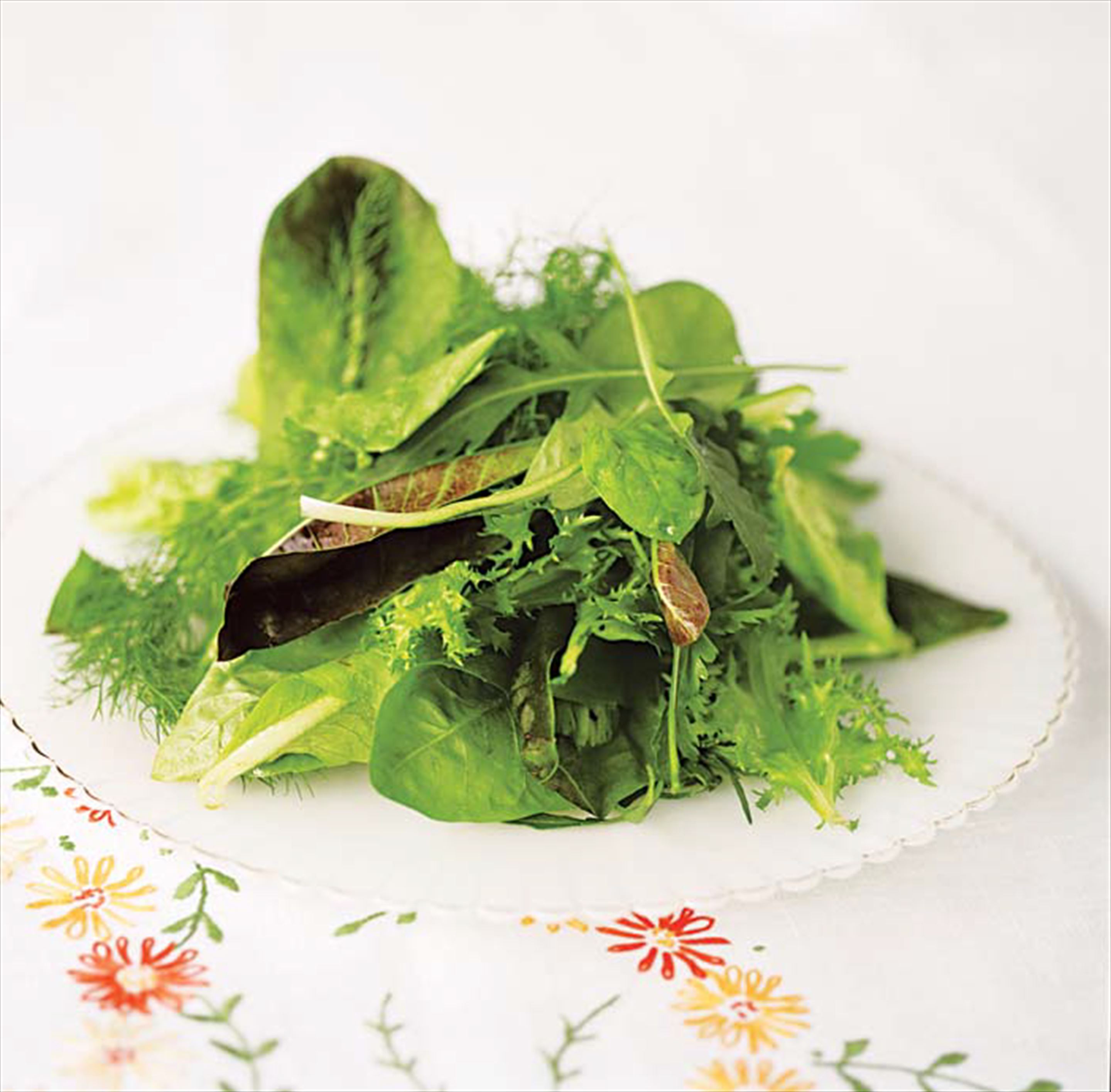 Leafy salad dressed with hazelnut vinaigrette