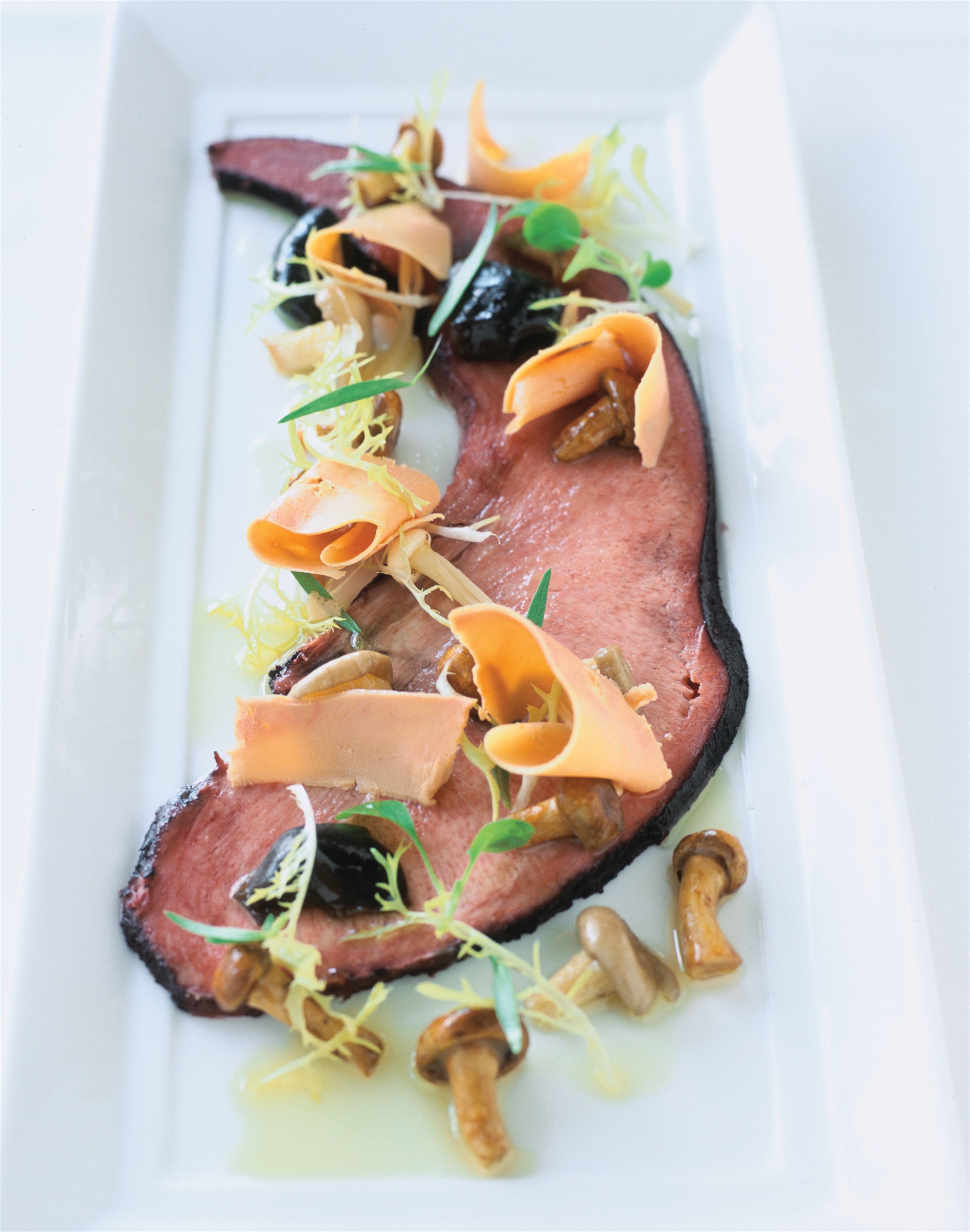 Pickled wagyu tongue with mushrooms à la grecque and shaved foie gras
