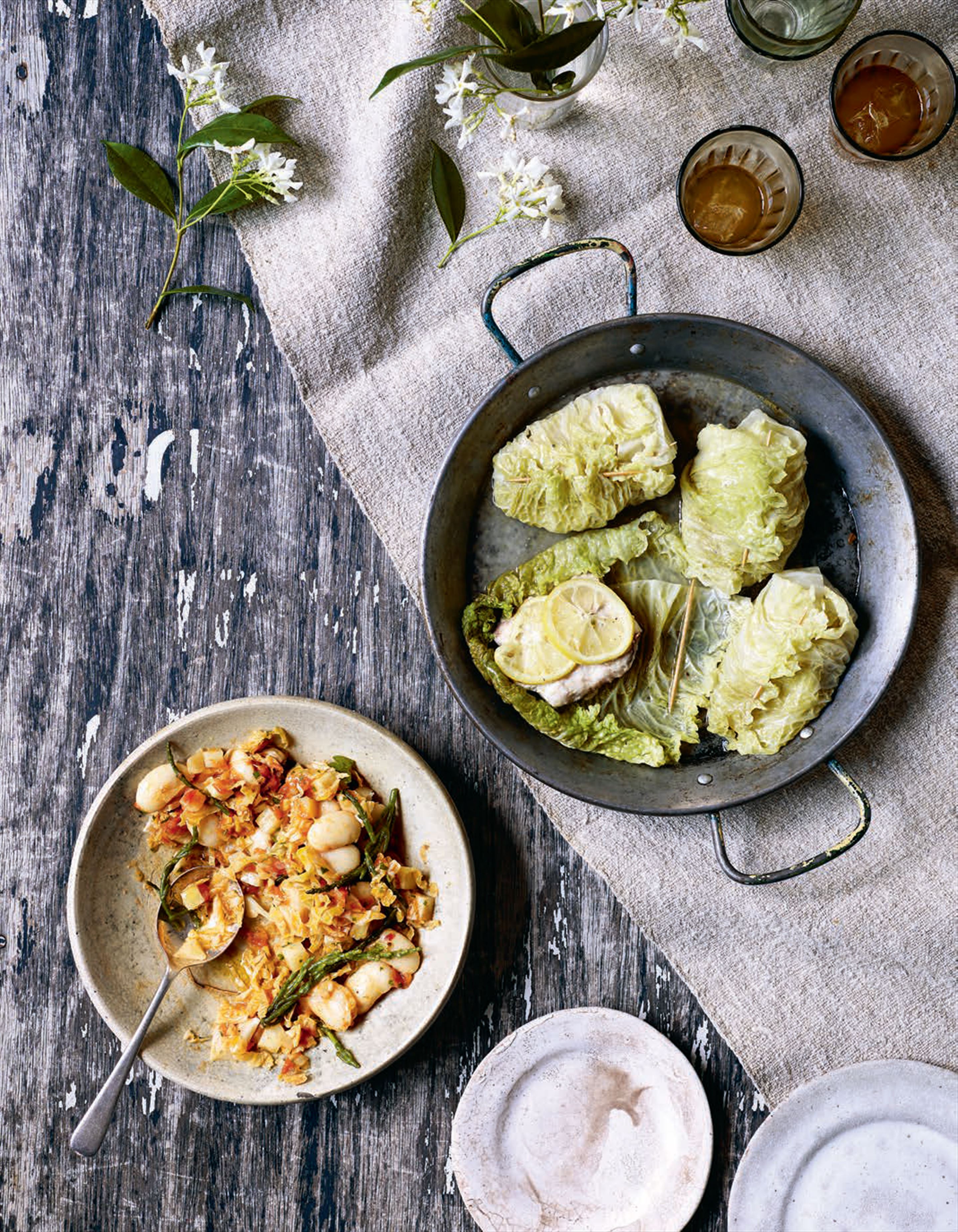 Savoy cabbage and snapper parcels with braised butter beans