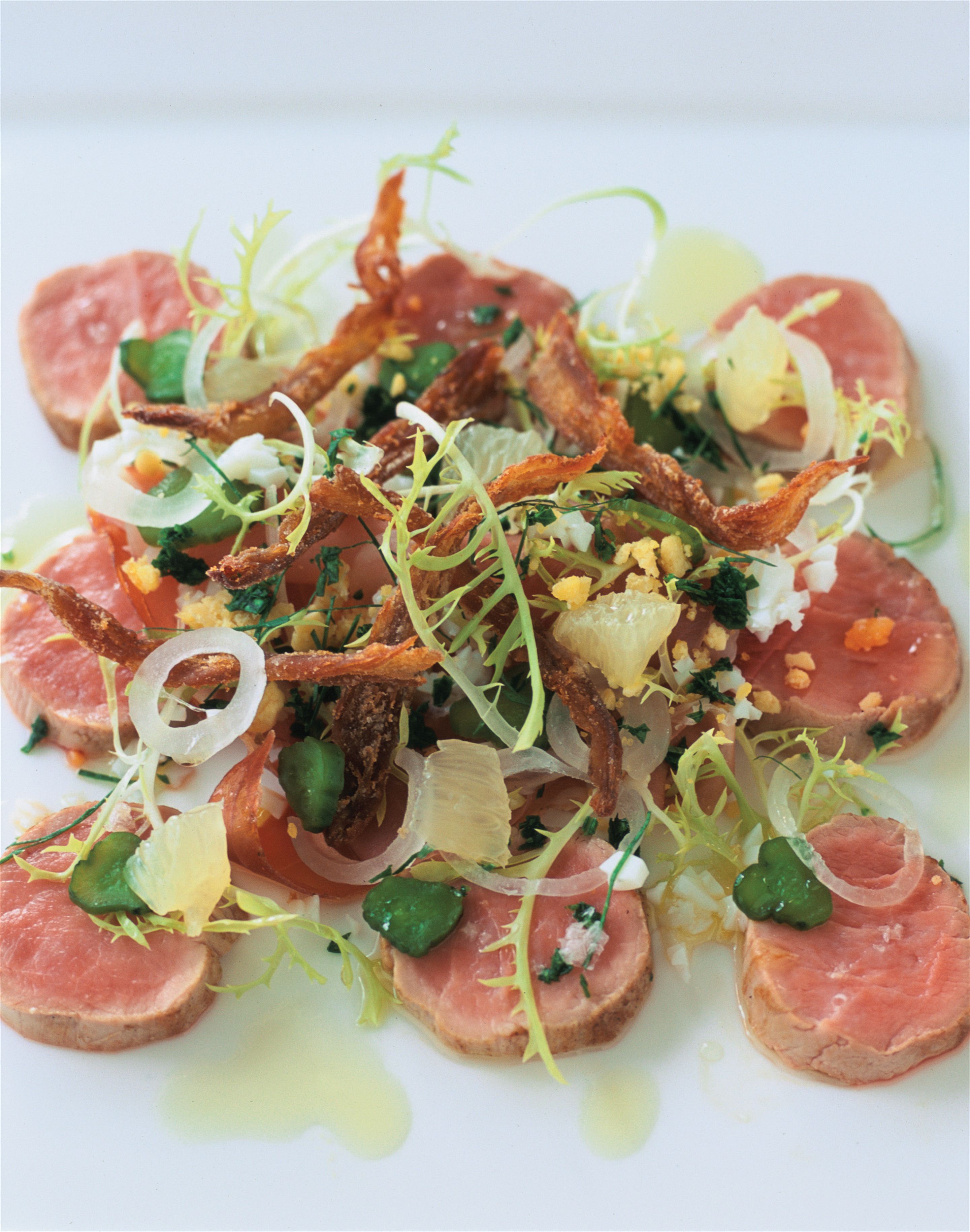 Slow-poached fillet of pork with gribiche vinaigrette and crisp pig’s tail