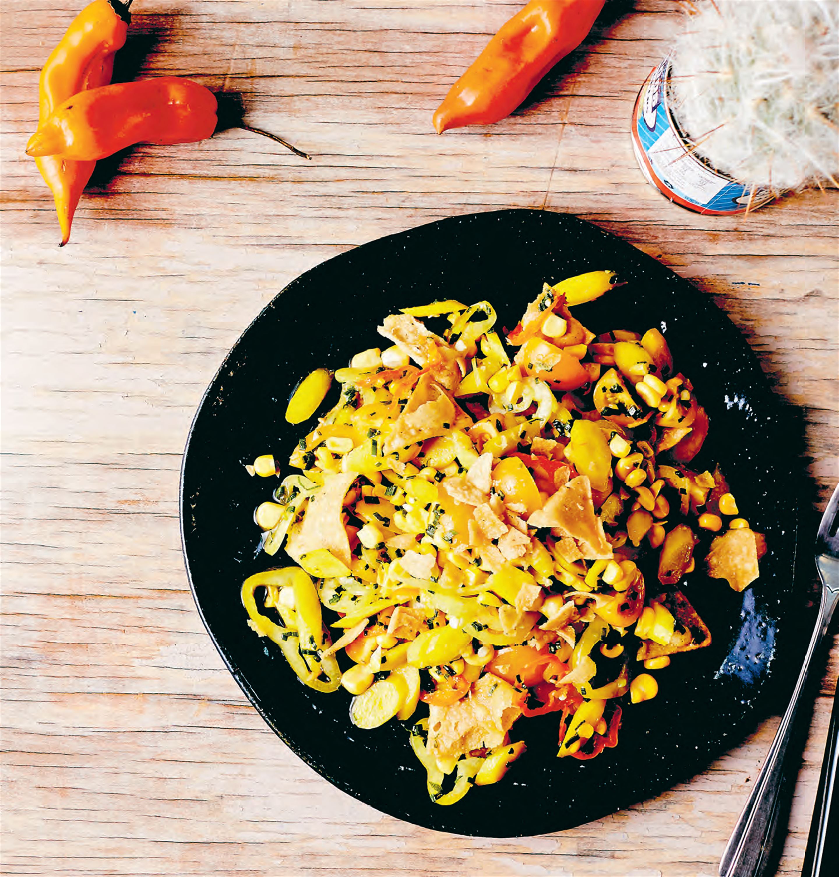 Young carrot, corn, amarillo & yellow tomato salad with smashed tortillas