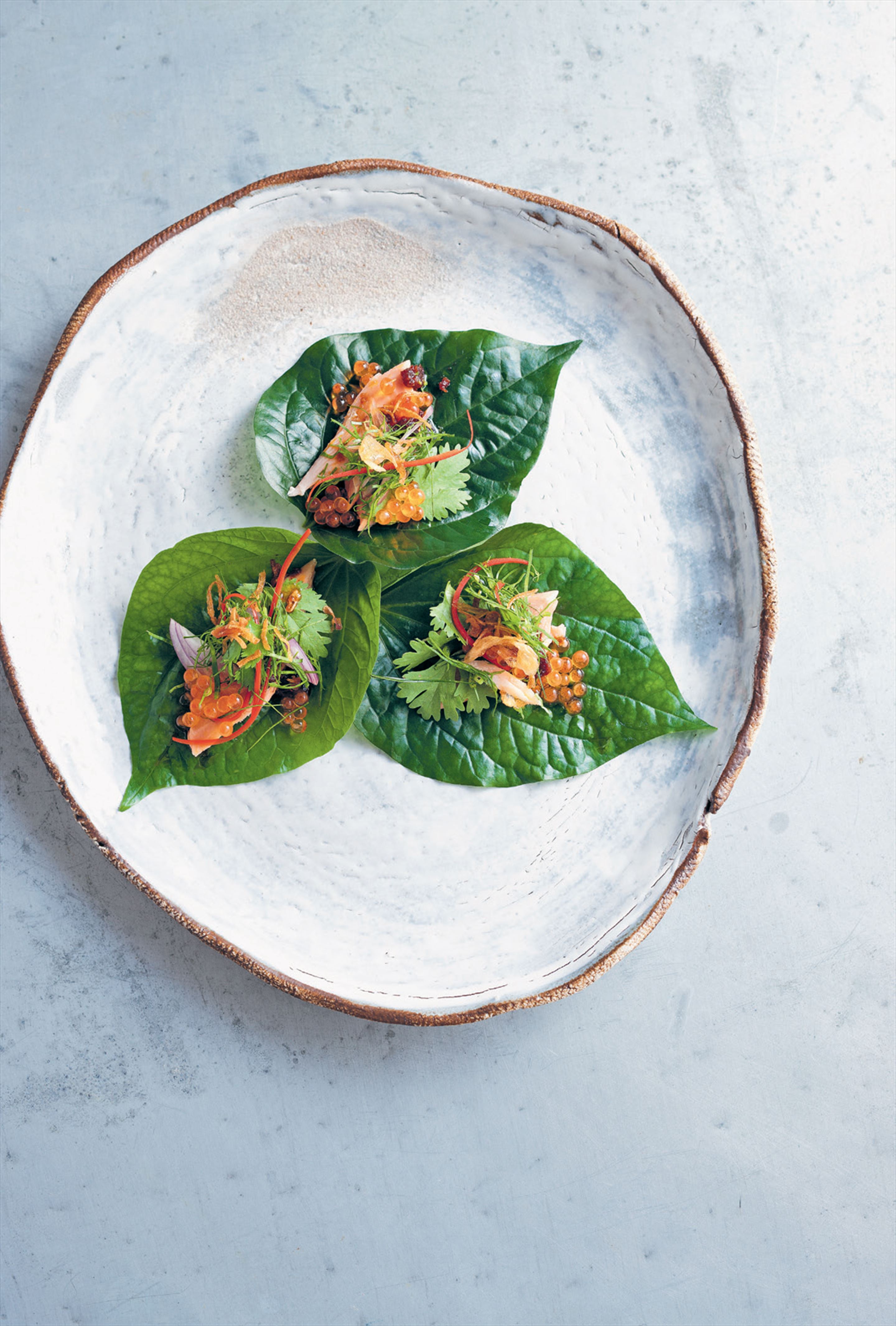 Betel leaves with smoked trout, galangal and trout roe