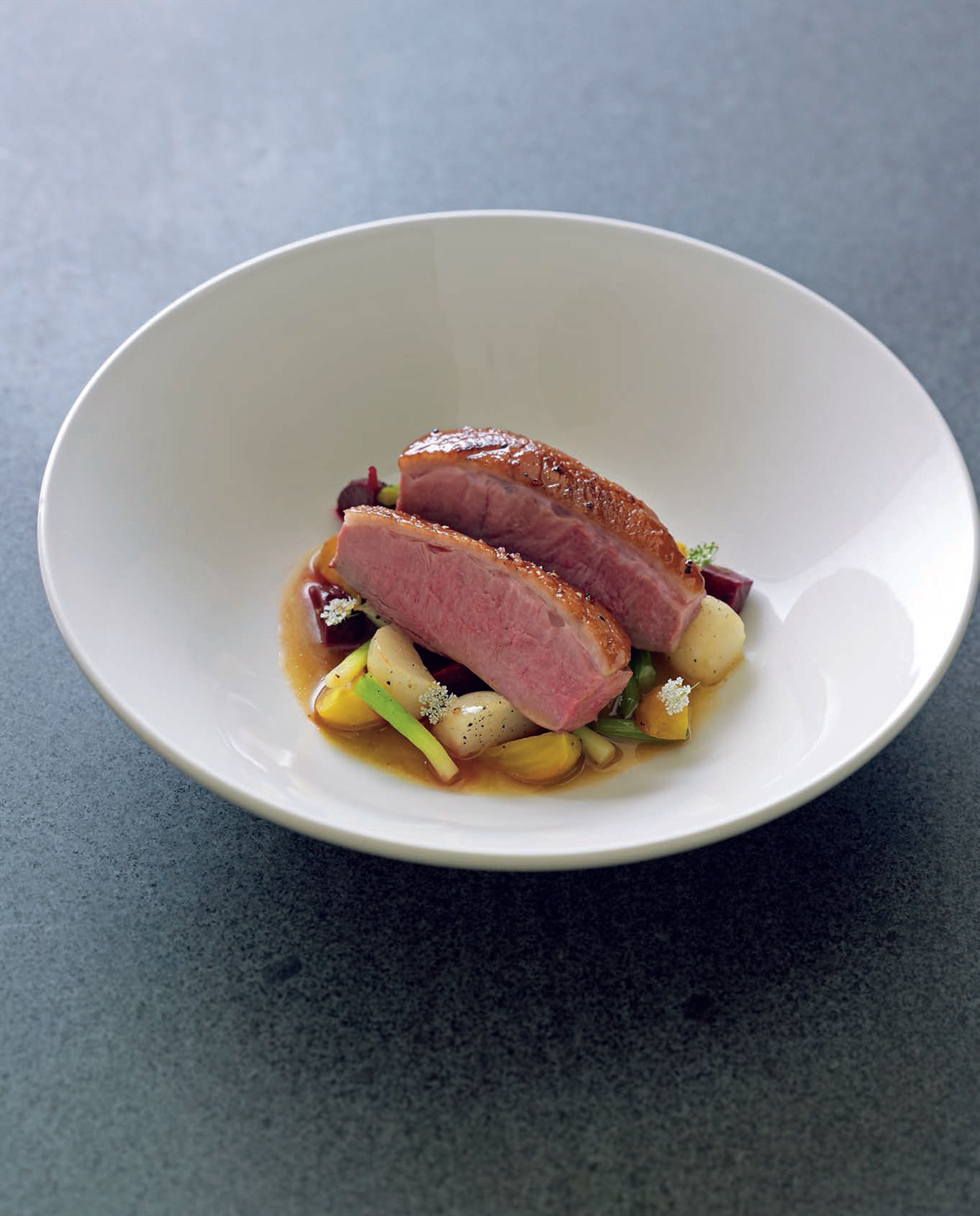 Cardamom and honey-glazed duck breasts with baby root vegetables