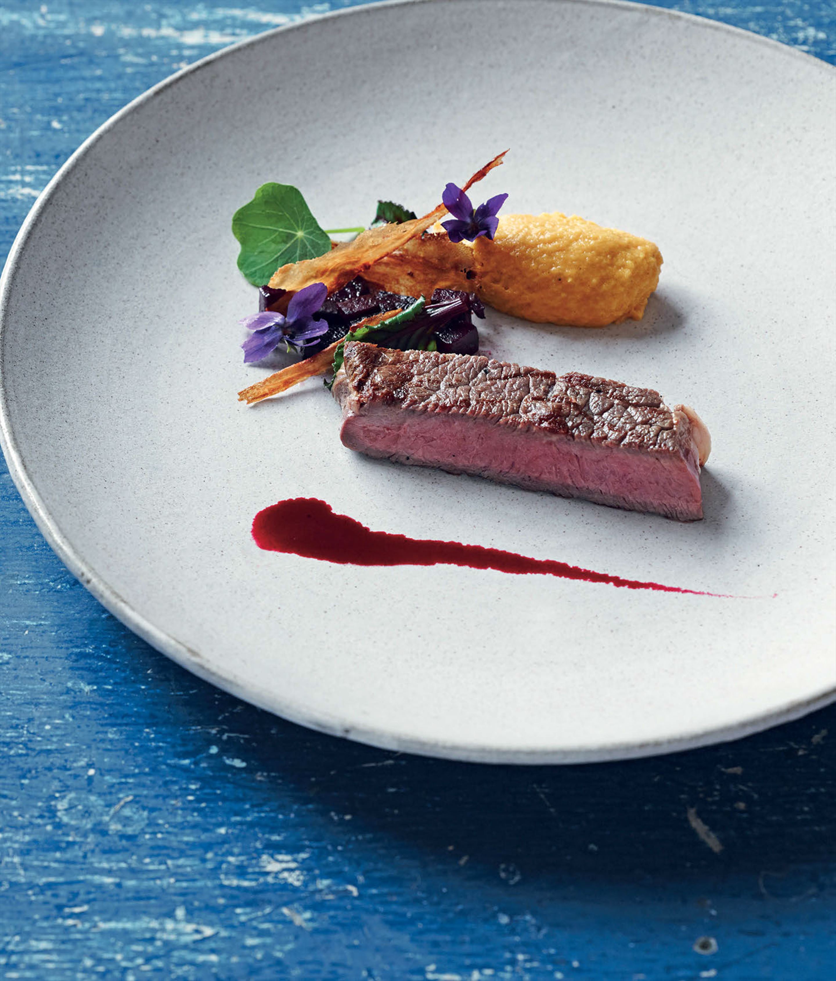 Roasted rib eye with beetroot and parsnip